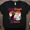 Live Laugh Lesbans t-shirt design with two cats inside a lesbian pride heart graphic