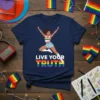 T-shirt with "Live Your Truth" text in rainbow colors and a woman in celebratory pose
