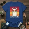Llama wearing sunglasses with "LLAMA DRAMA" text against a retro sunset background on a blue t-shirt