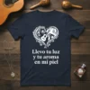 Spanish quote "Llevo tu luz y tu aroma en mi piel" on a navy t-shirt with a white heart graphic