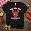 Lobster & Bow Crustacean Cuties EST. 2024 text design with a cute lobster wearing a bow tie on a black