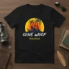 Lone Wolf Paradise t-shirt design with a wolf howling at a tropical sunset with palm trees and a flamingo