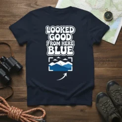 Navy t-shirt with "LOOKED GOOD FROM HERE BLUE" text and a framed mountain landscape graphic