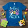 Blue t-shirt featuring cartoon shark, fish, and octopus singing "Los Tralaleritos Dicen Tralala"