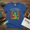 Lost in a good book text with a cute dragon reading in a library graphic on a blue t-shirt