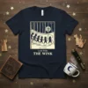 Louis Wain The Wink t-shirt featuring a vintage illustration of cats dancing under a smiling moon