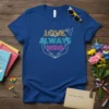 T-shirt with "LOVE ALWAYS WINS" text in colorful lines, peace dove, and cupped hands graphic, navy blue background