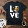 Love Breakfast t-shirt design with a smiling chef sun character cooking eggs and sausages in a pan
