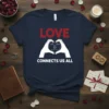 LOVE CONNECTS US ALL text with heart hands graphic on a navy blue t-shirt, symbolizing unity and love
