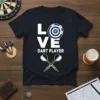 LOVE DART PLAYER text design with dartboard and crossed darts graphic on a navy t-shirt