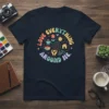 LOVE EVERYTHING AROUND ME quote t-shirt with colorful retro graphics including flowers, sun, house, and bicycle