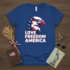 Love Freedom America text with an eagle wearing sunglasses on a blue t-shirt, patriotic design