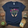 Love grows here EST. 2024 T-Shirt with heart tree design and hands, navy blue shirt