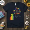 Rainbow cat silhouette and colorful sunflower with "love is love" text on a navy blue t-shirt