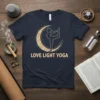 Love Light Yoga text with a yogi silhouette in a dancer's pose within a crescent moon graphic, navy t-shirt design