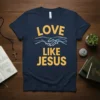 Navy t-shirt with bold yellow text "LOVE LIKE JESUS" and graphic of two hands clasped