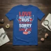 LOVE NEEDS ACTION TRUST NEEDS PROOF SORRY NEEDS CHANGE text design on a royal blue t-shirt with red and white