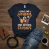Quote "LOVE ONE Woman AND SEVERAL Guitars" with three guitars and hearts on a navy t-shirt