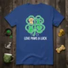 Love Paws & Luck t-shirt with dog and cat faces inside a clover, green outline, white text