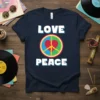 Navy t-shirt with "LOVE PEACE" text above and below a colorful peace sign graphic