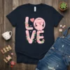 LOVE Pig Design T-Shirt with a cute pink pig holding a red heart balloon and floral accents