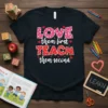 Teacher shirt with text "LOVE them first TEACH them second" in pink and red heart patterns, surrounded by small red