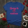 Loving tu FOREVER quote with heart graphic on a royal blue t-shirt