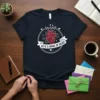 Loving Us Is A Work Of Heart quote with anatomical heart graphic on navy t-shirt