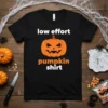 Black t-shirt with "low effort pumpkin shirt" text and a jack-o'-lantern graphic for Halloween