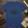 Luckier to be Scottish text with a purple thistle and green tartan pattern on a royal blue t-shirt