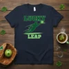 Lucky Leap t-shirt with a green graphic of a baseball player diving for a shamrock