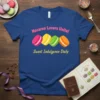 Macaron Lovers Unite! Sweet Indulgence Daily text on a blue t-shirt with colorful macaron graphics