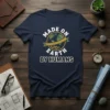 Made On Earth By Humans t-shirt with globe graphic and gears, white text on navy blue shirt