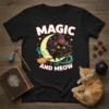 Magic and Meow Halloween t-shirt with a cute black witch cat flying on a broomstick across a crescent moon