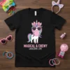 Black t-shirt featuring a cartoon unicorn with heart-shaped sunglasses blowing bubblegum, text "MAGICAL & CHEWY UNICORN LIFE"