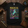 Black t-shirt featuring the text "MAGICAL HORN TUSK" and a colorful unicorn illustration surrounded by words like Meadow, Fairy, and