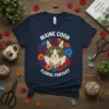 Maine Coon cat portrait surrounded by colorful flowers with text "MAINE COON FLORAL FANTASY" on a navy t-shirt