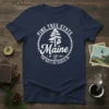 Navy t-shirt with "Pine Tree State Maine The Way Life Should Be" in white circular text and a pine tree