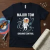 Major Tom Ground Control t-shirt design with an astronaut cat wearing a spacewalk suit and a lightning bolt on its