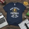 Make Fantasy Football Great Again text with trophy and football helmets graphic on a navy t-shirt