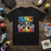 Black t-shirt with "MAKE YOUR MARK" in colorful graffiti font and a spray can character emitting rainbows