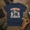 Navy t-shirt with bold red and white text "MAKE YOURSELF HARD TO KILL" and a graphic of a fist breaking