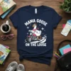 Mama Goose On The Loose T-Shirt featuring a cartoon goose riding a motorcycle, white text on navy shirt