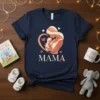 Mama heart graphic t-shirt with mother holding baby, featuring bold text and soft colors