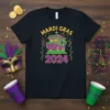 Mardi Gras 2024 t-shirt design featuring a colorful parade float, mask, and festive decorations in purple, green, and gold