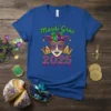 Mardi Gras 2025 t-shirt with jester mask, crowns, and purple and green festive text