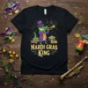 Mardi Gras King t-shirt design with a green alligator wearing a purple suit and top hat playing a trumpet, surrounded