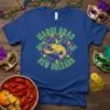 Mardi Gras New Orleans t-shirt featuring a gold crawfish and fleur-de-lis in purple and green circular design