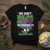 Mardi Gras t-shirt with text "We Don't Hide Our Crazy We Parade It!", featuring masks, alligators, and a ship