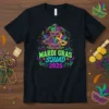 Mardi Gras Squad 2025 text with masks and festive decorations on a black t-shirt